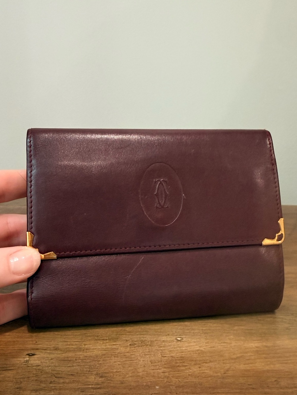 Cartier Burgundy Leather Wallet with Gold Accents